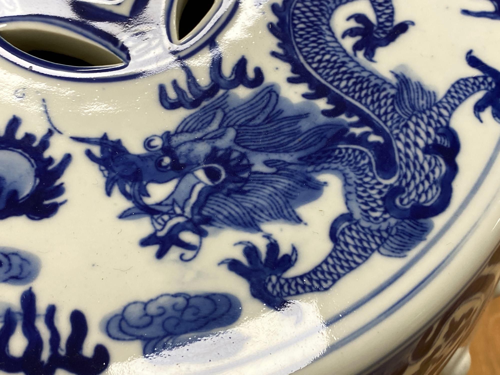 A Chinese blue and white ceramic garden seat and a similar elephant seat, 47.5cm tall